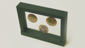 Three custom-minted coins in our V19 coin display.