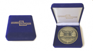 Custom-printed high quality packaging in blue velvet for the university challenge coins.