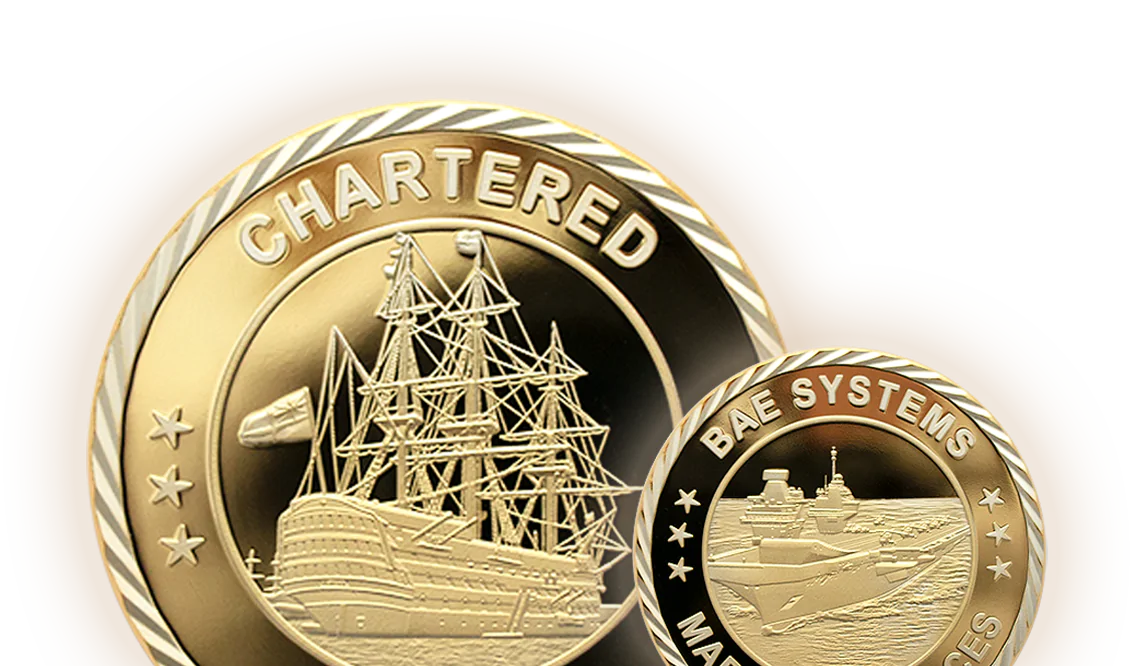 Custom coins for BAE Systems showing a tall ship and an aircraft carrier